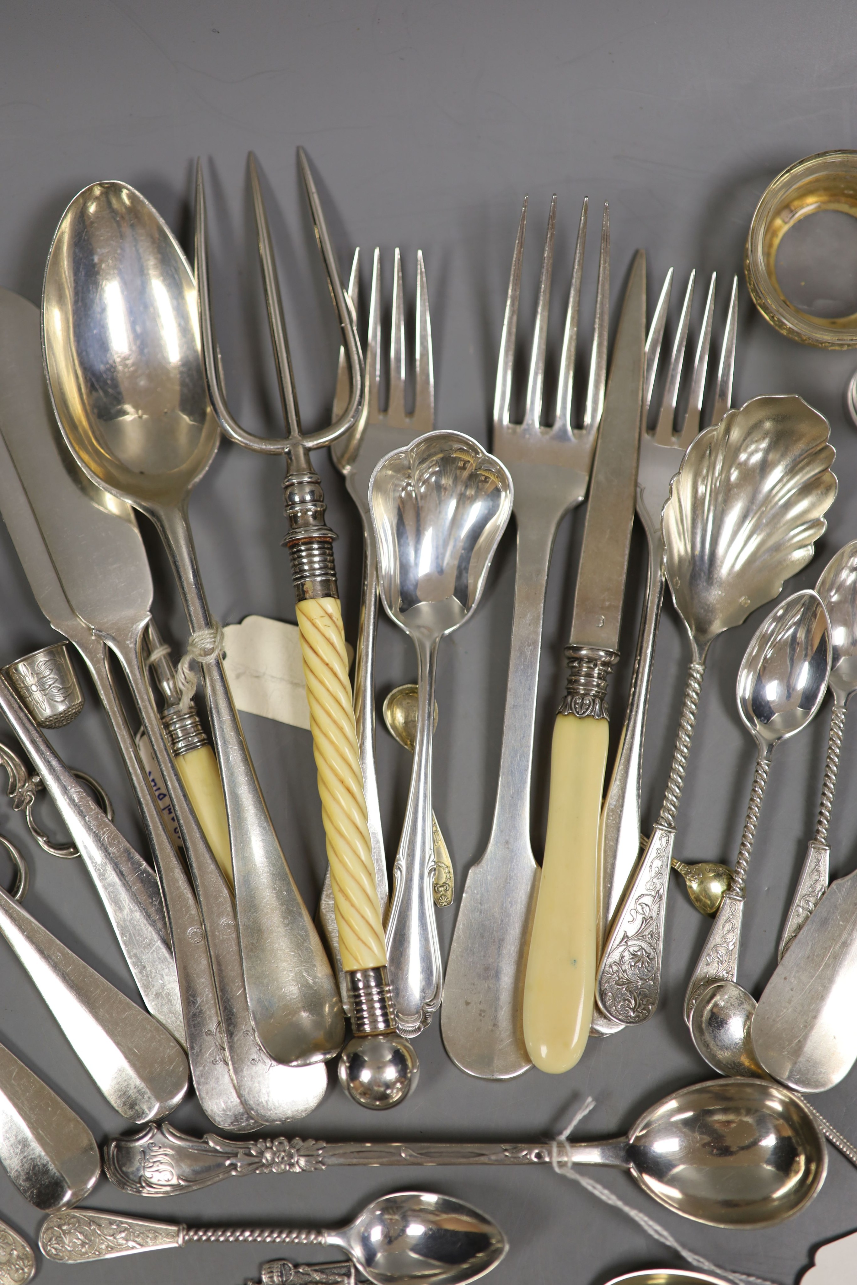 A pair of German 800 gilt white metal salts and a quantity of continental white metal flatware including French, Dutch and Austro-Hungarian, weighable white metal 13oz and a group of plated flatware.